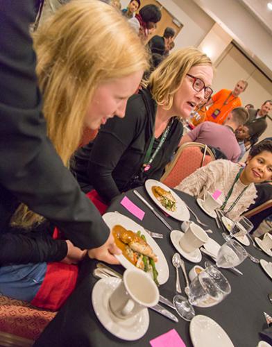 Pearl Daskam (left) at the Oxfam America Hunger Banquet at the 2016 World Food Prize Global Youth Institute.