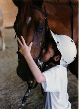 ACEE poster of child kissing a horse