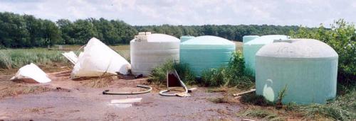 Collapsed poly tanks. Photo credit: Jack Knorek, Michigan Department of Agriculture and Rural Development