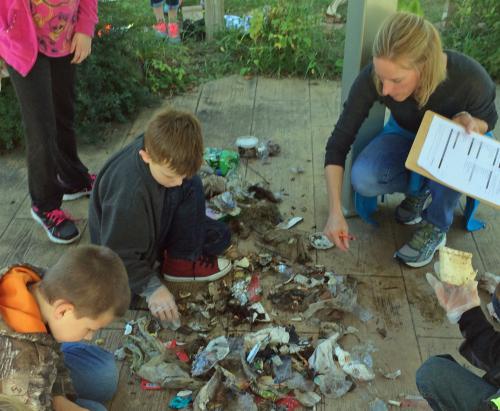 Students review debris they recovered at Rotary Island