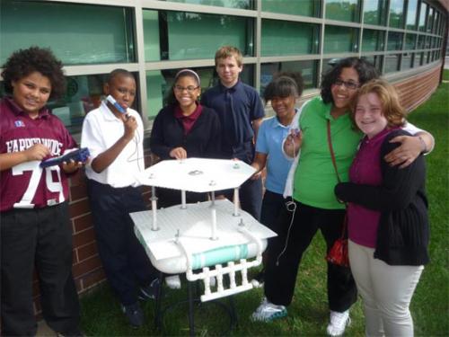 Harper Woods Middle School students working with basic observation buoy (BOB) image.
